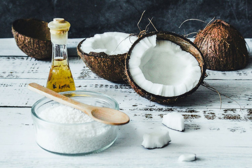 Coconut and coconut oil representing only natural ingredients like cocoa butter, beeswax and vitamin E in Squirrel's Nut Butter skin care products